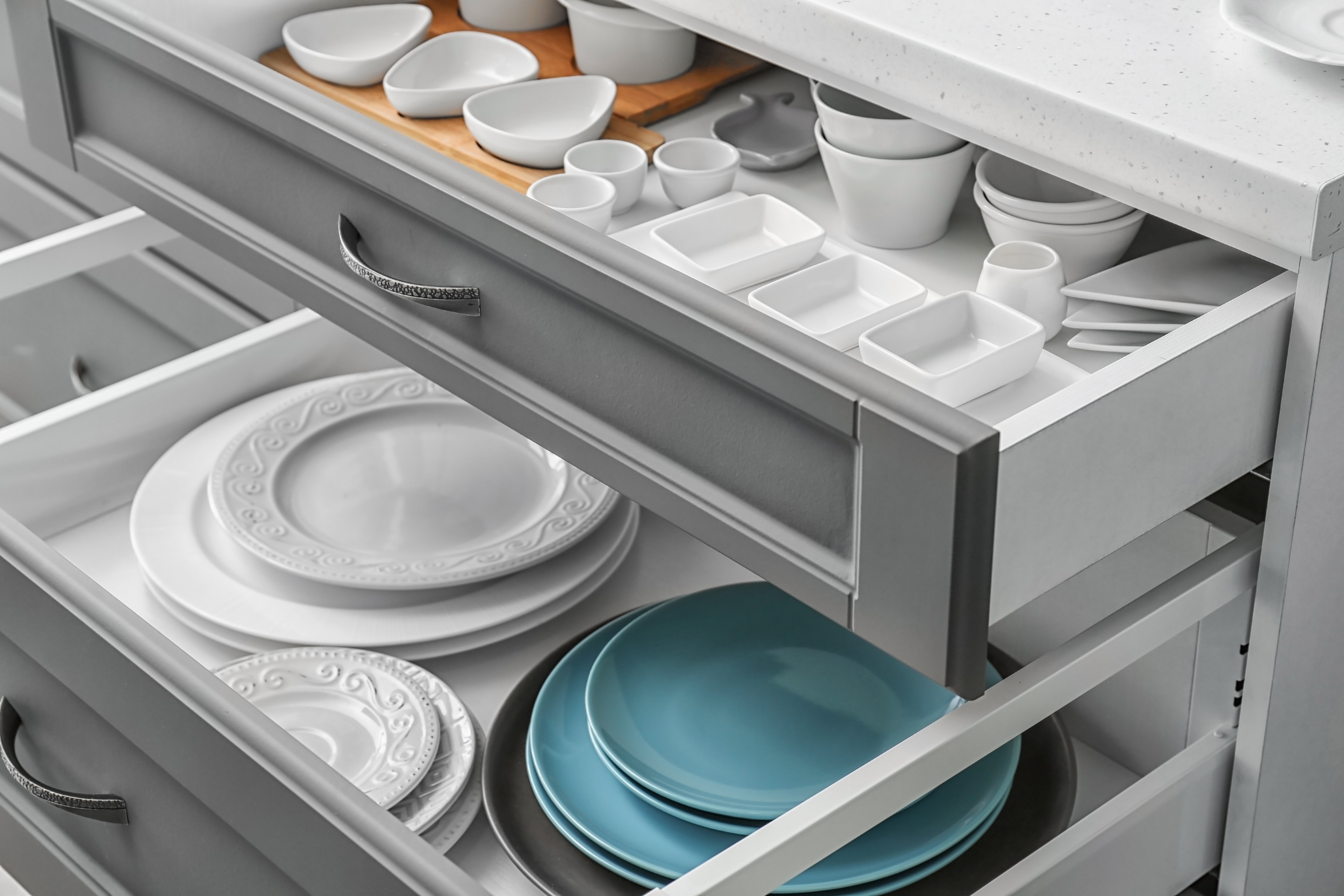Set of tableware in kitchen drawers | Pierce Carpet Mill Outlet