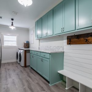 Mint green and white laundry room with mudroom, counter space, oversized | Pierce Carpet Mill Outlet