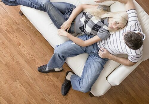 Couple sitting on sofa | Pierce Carpet Mill Outlet