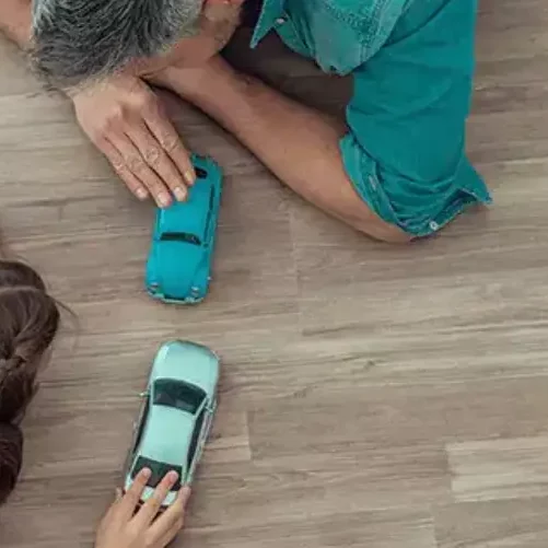 after-vinyl-installation Dad & girl Playing with toys | Pierce Carpet Mill Outlet