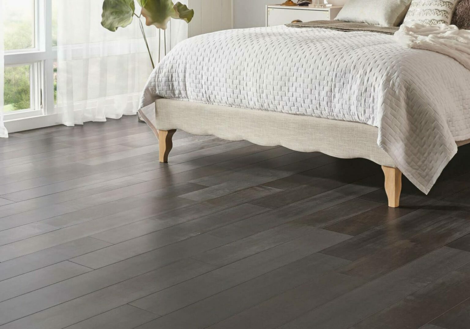 Dark hardwood flooring in bedroom | Pierce Carpet Mill Outlet